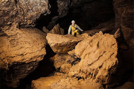 esploratrice - Young female caver exploring the cave. Mlynky Cave, Ukraine Fotografie stock - Microstock e Abbonamento, Codice: 400-07955008