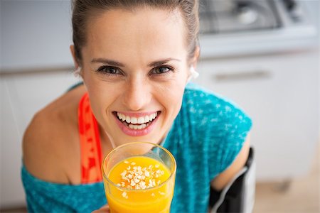 smoothie sports - Portrait of happy fitness young woman with pumpkin smoothie Stock Photo - Budget Royalty-Free & Subscription, Code: 400-07955822