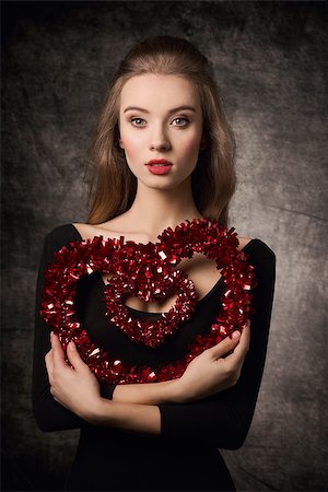 simsearch:400-07986693,k - Beautiful, young, elegant, fresh, valentine girl with nice hairstyle and make up is holding heart. Stock Photo - Budget Royalty-Free & Subscription, Code: 400-07955881