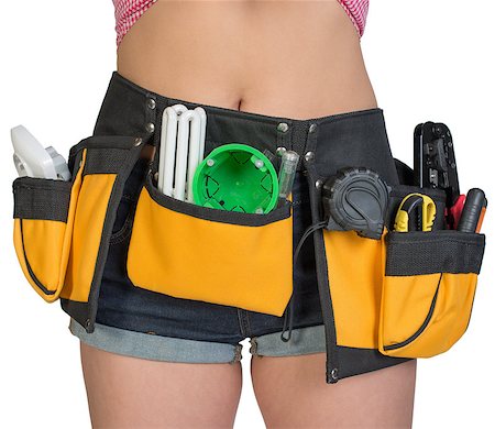 Woman in tool belt, close-up. Isolated on white background Stock Photo - Budget Royalty-Free & Subscription, Code: 400-07956466