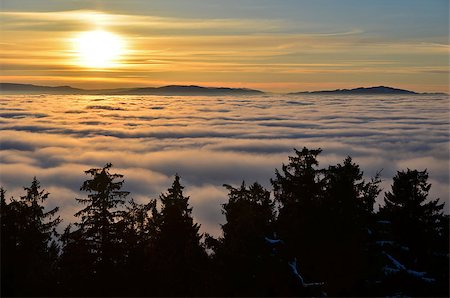 studio023 (artist) - view of the sunset above the clouds Stockbilder - Microstock & Abonnement, Bildnummer: 400-07956460