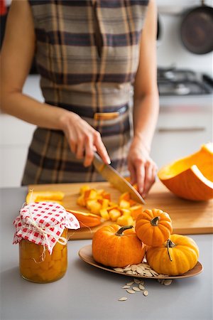 simsearch:400-07956836,k - Closeup on young housewife cutting pumpkin for pickling Foto de stock - Royalty-Free Super Valor e Assinatura, Número: 400-07956567