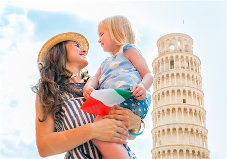 simsearch:400-07954318,k - Portrait of happy mother and baby girl with italian flag in front of leaning tower of pisa, tuscany, italy Stock Photo - Budget Royalty-Free & Subscription, Code: 400-07956935
