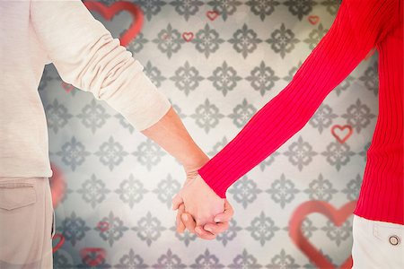 simsearch:400-07957006,k - Couple holding hands rear view against love heart pattern Stock Photo - Budget Royalty-Free & Subscription, Code: 400-07957018