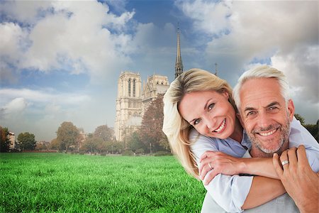 simsearch:640-06051593,k - Happy couple standing and hugging against notre dame cathedral Stock Photo - Budget Royalty-Free & Subscription, Code: 400-07957034