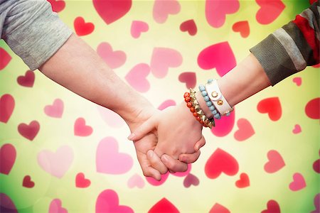 simsearch:400-07957805,k - Students holding hands against valentines heart design Photographie de stock - Aubaine LD & Abonnement, Code: 400-07957030