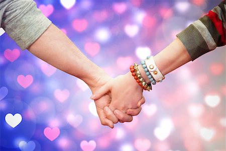 simsearch:400-07957006,k - Students holding hands against valentines heart pattern Stock Photo - Budget Royalty-Free & Subscription, Code: 400-07957031