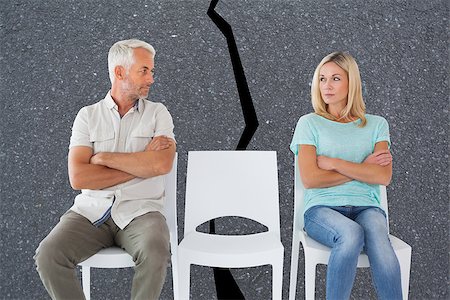 simsearch:400-07726420,k - Unhappy couple not speaking to each other  against road Fotografie stock - Microstock e Abbonamento, Codice: 400-07957102