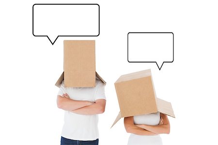 Mature couple wearing boxes over their heads against speech bubble Stock Photo - Budget Royalty-Free & Subscription, Code: 400-07957186