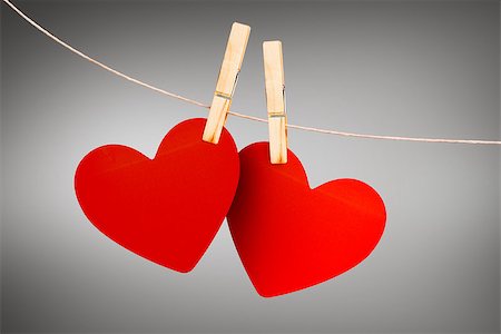 simsearch:400-07957226,k - Hearts hanging on line against grey vignette Stock Photo - Budget Royalty-Free & Subscription, Code: 400-07957225