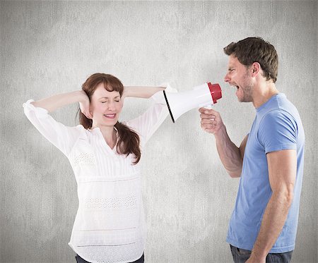 simsearch:400-07957339,k - Man shouting through a megaphone against weathered surface Photographie de stock - Aubaine LD & Abonnement, Code: 400-07957327