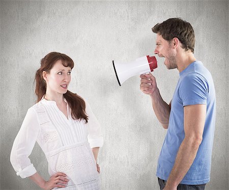 simsearch:400-07957339,k - Man shouting through a megaphone against weathered surface Photographie de stock - Aubaine LD & Abonnement, Code: 400-07957328