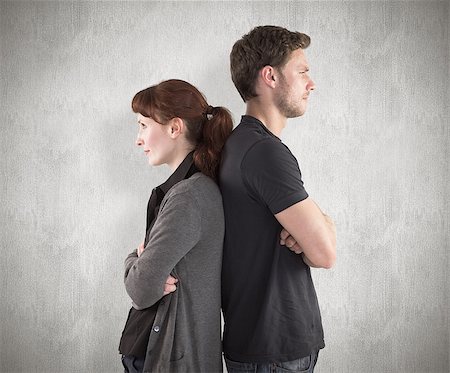 simsearch:400-07957339,k - Irritated couple ignoring each other against weathered surface Photographie de stock - Aubaine LD & Abonnement, Code: 400-07957333