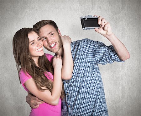 Couple taking selfie with digital camera against weathered surface Photographie de stock - Aubaine LD & Abonnement, Code: 400-07957377
