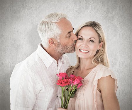 Affectionate man kissing his wife on the cheek with roses against weathered surface Photographie de stock - Aubaine LD & Abonnement, Code: 400-07957388
