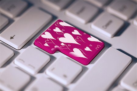 simsearch:400-07957805,k - Valentines day pattern against pink enter key on keyboard Photographie de stock - Aubaine LD & Abonnement, Code: 400-07957647