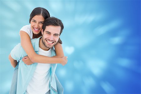 simsearch:400-07957006,k - Happy casual man giving pretty girlfriend piggy back against valentines heart design Stock Photo - Budget Royalty-Free & Subscription, Code: 400-07957794