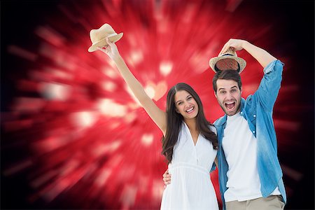 simsearch:400-07957212,k - Happy hipster couple smiling at camera and cheering against valentines heart design Stock Photo - Budget Royalty-Free & Subscription, Code: 400-07957793