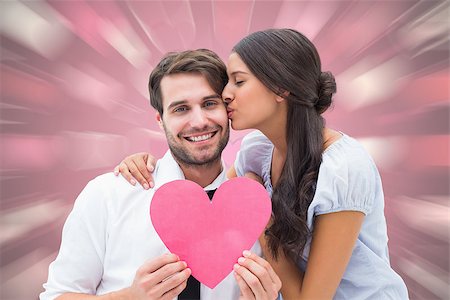 simsearch:400-07957805,k - Pretty brunette giving boyfriend a kiss and her heart against valentines heart pattern Photographie de stock - Aubaine LD & Abonnement, Code: 400-07957805