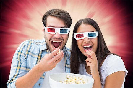 simsearch:400-07957212,k - Attractive young couple watching a 3d movie against valentines heart design Stock Photo - Budget Royalty-Free & Subscription, Code: 400-07957803
