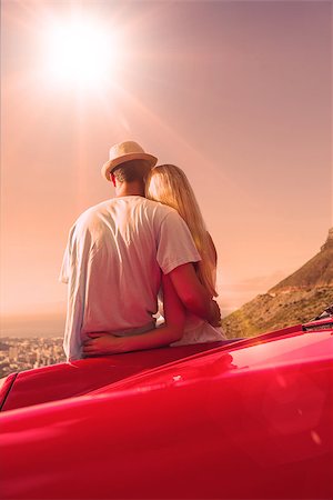 Cute couple hugging and admiring panorama on a sunny day Stock Photo - Budget Royalty-Free & Subscription, Code: 400-07958036