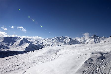 simsearch:400-08780271,k - Ski slope in nice evening. Georgia, ski resort Gudauri. Caucasus Mountains. Wide-angle view. Photographie de stock - Aubaine LD & Abonnement, Code: 400-07951301