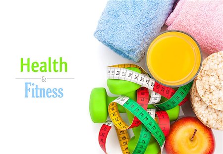 simsearch:400-07754604,k - Dumbells, tape measure, healthy food and towels. Fitness and health. Isolated on white background Fotografie stock - Microstock e Abbonamento, Codice: 400-07951419