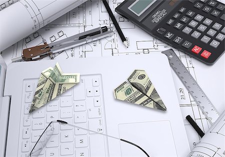 drawing compass - Paper airplanes of dollars lying on laptop keyboard. Architectural drawings and tools are close by. Concept of building business Stock Photo - Budget Royalty-Free & Subscription, Code: 400-07951448