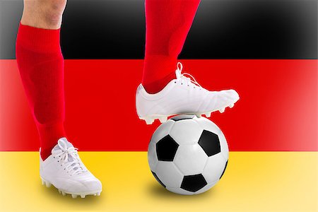 simsearch:400-06513403,k - Germany soccer player with football for competition in Match game. Stock Photo - Budget Royalty-Free & Subscription, Code: 400-07951945