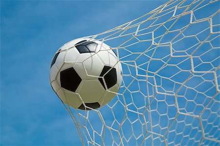 simsearch:400-08372849,k - Soccer ball in the goal after shooted in the game Stock Photo - Budget Royalty-Free & Subscription, Code: 400-07951995