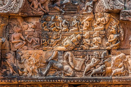 lintel carving of Ravana god at Banteay Srei hindu pink temple Cambodia Stockbilder - Microstock & Abonnement, Bildnummer: 400-07952359