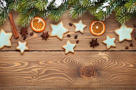 simsearch:400-07614271,k - Christmas wooden background with snow fir tree, spices, gingerbread cookies. View from above with copy space Foto de stock - Royalty-Free Super Valor e Assinatura, Número: 400-07952873