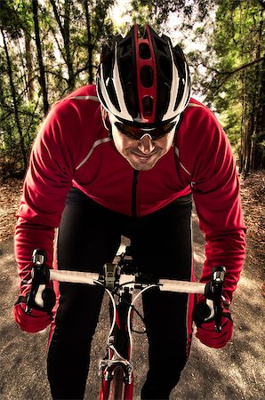 effigy - Cyclist on road bike through a forest. Stock Photo - Budget Royalty-Free & Subscription, Code: 400-07952897