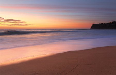 simsearch:400-07667033,k - Stunning sunrise at Bungan Beach on Sydney's northern beaches with views southward toward Mona Vale headland Stock Photo - Budget Royalty-Free & Subscription, Code: 400-07952924