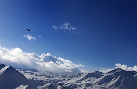 Helicopter above snowy plateau and sunny sky. Ski resort Gudauri. Caucasus Mountains, Georgia. Stock Photo - Budget Royalty-Free & Subscription, Code: 400-07953544