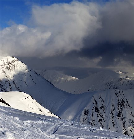 simsearch:400-08530488,k - Off-piste slope and mountains with storm clouds. Caucasus Mountains, Georgia. Ski resort Gudauri. Stock Photo - Budget Royalty-Free & Subscription, Code: 400-07953547