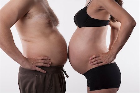 female belly fat - pregnant woman and fat man top nude on white background Stock Photo - Budget Royalty-Free & Subscription, Code: 400-07974211