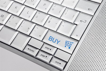 simsearch:400-04442555,k - Silver keyboard with shopping cart icon and BUY text on keys. E commerce concept. Photographie de stock - Aubaine LD & Abonnement, Code: 400-07974227