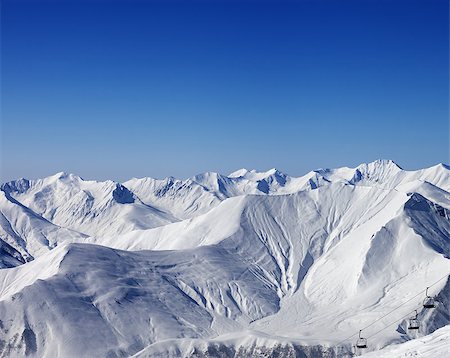 simsearch:400-07093256,k - Winter mountains and chair-lift at nice day. Caucasus Mountains, Georgia. Ski resort Gudauri. Stock Photo - Budget Royalty-Free & Subscription, Code: 400-07975250