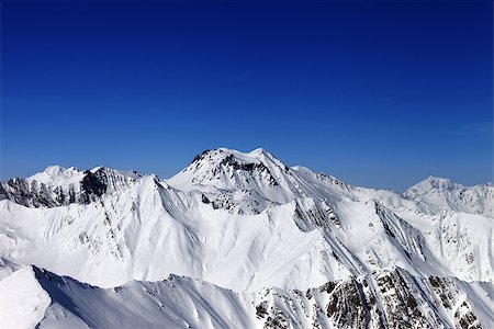 simsearch:400-08530488,k - Snowy mountains in sun day. View from ski resort Gudauri. Caucasus Mountains, Georgia. Stock Photo - Budget Royalty-Free & Subscription, Code: 400-07975251