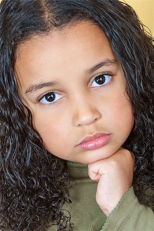 A beautiful mixed race African American little girl female child looking sad and sulking Stock Photo - Budget Royalty-Free & Subscription, Code: 400-07975561