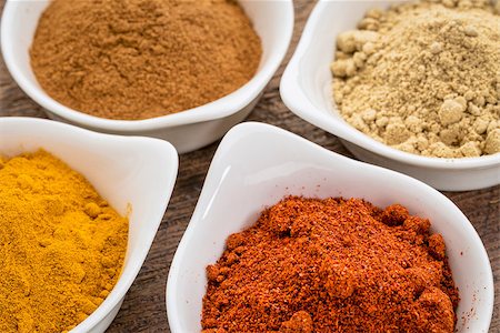 simsearch:400-07300783,k - four healthy spices (turmeric, ginger, cinnamon and paprika) in white bowls Stockbilder - Microstock & Abonnement, Bildnummer: 400-07976543