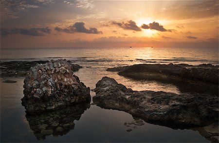 Sunset over the Sea and Rocky Coast with Ancient Ruins in Mahdia, Tunisia Stock Photo - Budget Royalty-Free & Subscription, Code: 400-07978310