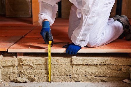 floor heat - Measuring the thickness of thermal insulation - worker hands with tape measure Stock Photo - Budget Royalty-Free & Subscription, Code: 400-07978826