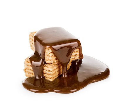 dark chocolate - sweet caramel sauce is poured on a waffle cookies Photographie de stock - Aubaine LD & Abonnement, Code: 400-07979804