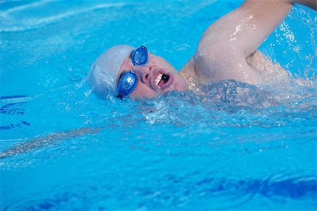 group of happy kids children   at swimming pool class  learning to swim Stock Photo - Budget Royalty-Free & Subscription, Code: 400-07971752