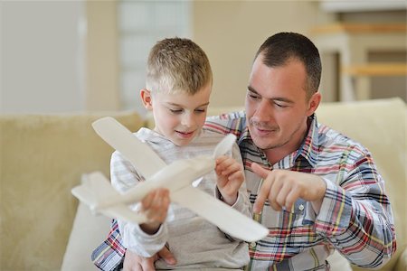 father and son with toy airplane - father and son assembling airplane toy at modern home living room indoor Stock Photo - Budget Royalty-Free & Subscription, Code: 400-07972067