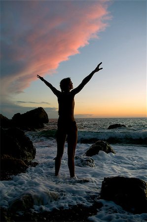 simsearch:400-04662543,k - Young, healthy woman is enjoying life. Woman's silhouette is situated against the lovely sunset. Stock Photo - Budget Royalty-Free & Subscription, Code: 400-07972225