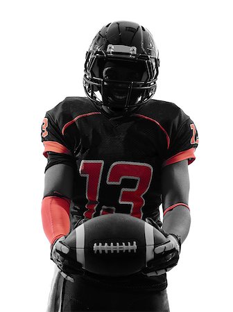 simsearch:400-07973138,k - one american football player standing holding ball in silhouette shadow on white background Stock Photo - Budget Royalty-Free & Subscription, Code: 400-07973133