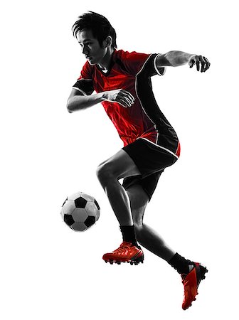 simsearch:400-07973357,k - one asian soccer player young man dribbling in silhouette isolated white background Stock Photo - Budget Royalty-Free & Subscription, Code: 400-07973144